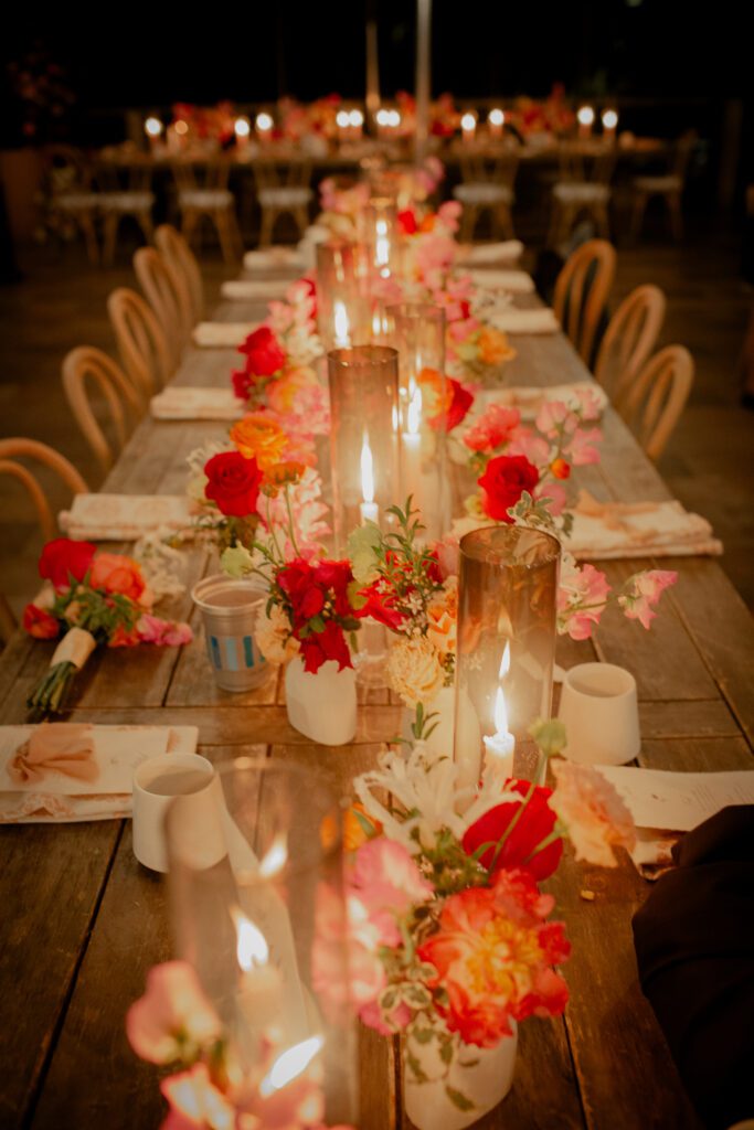 Elegant wooden table setting creates a romantic, cozy atmosphere perfect for an intimate autumn dinner celebration.
